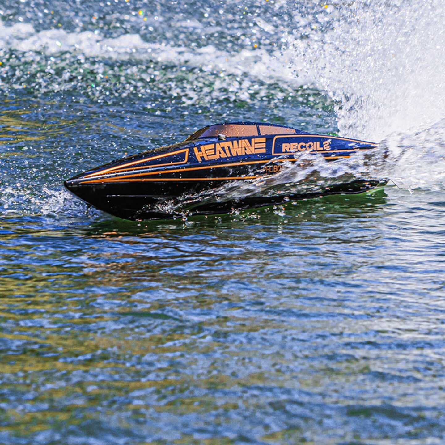 RC boat on a lake. Click to browse all RC boats and boat accessories.